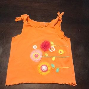 Baby’s orange tank top!